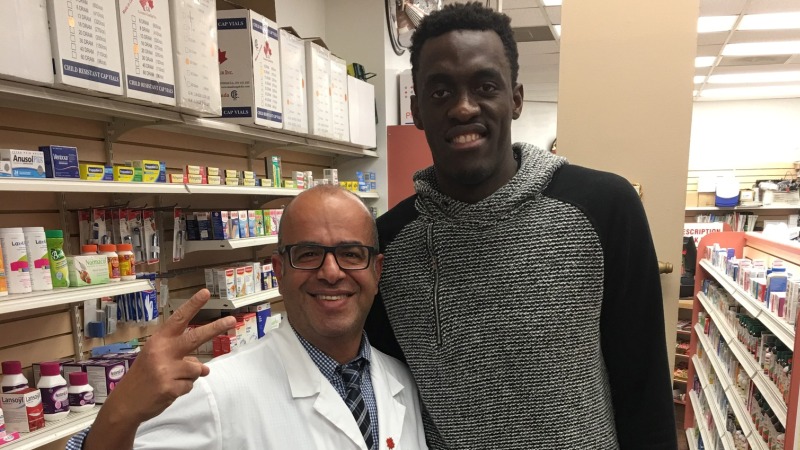 Pharmacist reviewing medications with a patient