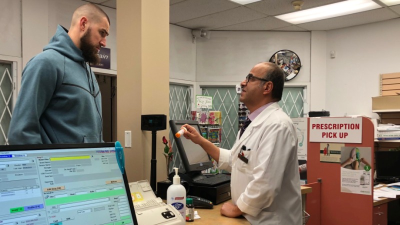Pharmacist reviewing a prescription